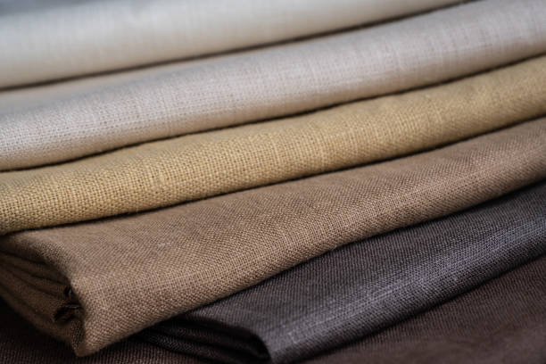istock Stack of brown linen fabrics, close up 1343844224