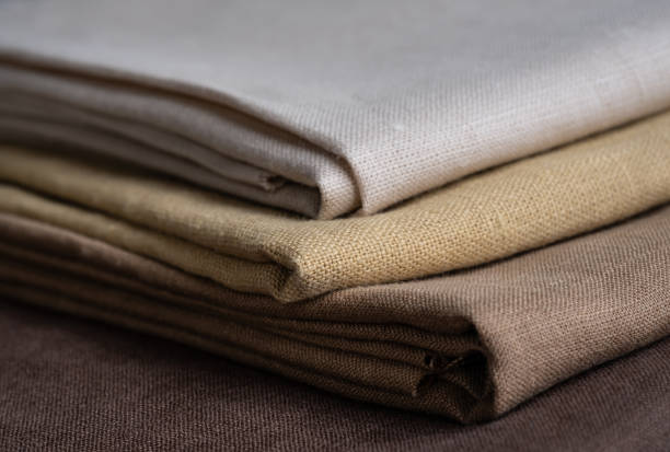 istock Stack of brown linen fabrics, close up 1343844238