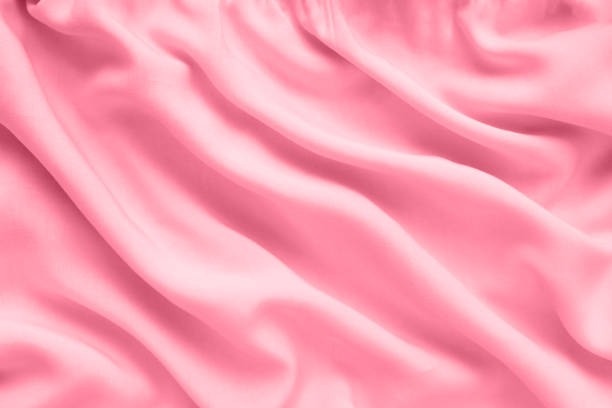 istock Pink silk texture, abstract background luxury fabric with wavy folds 1343844254