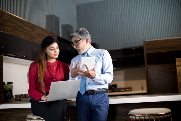 istock Business people using laptop and digital tablet at office 1343844603