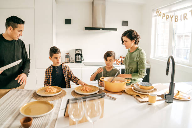 istock Family in the kitchen serving lunch 1343845947