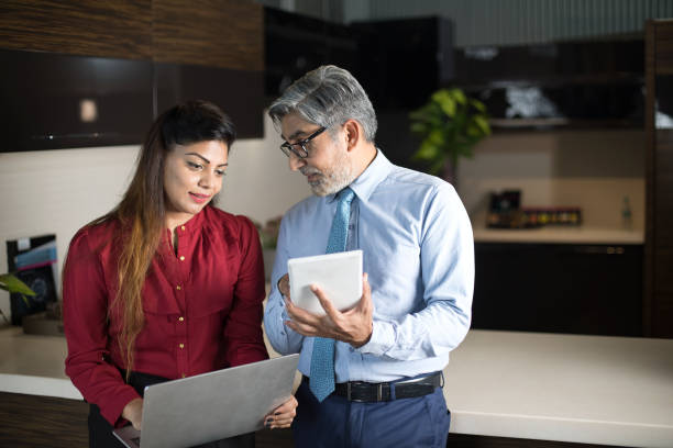 istock Business people using laptop and digital tablet at office 1343845949