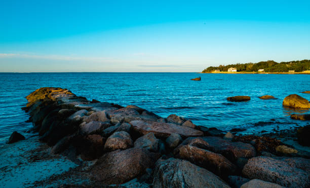 istock Tranquil seascape with a seaweed-covered jetty at the coastal village on Cape Cod 1343846738
