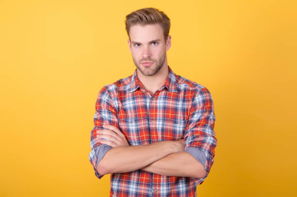 Being serious. Menswear shop. Macho man wearing checkered shirt. Fashion summer trends. Unshaven man skin care. Barbershop concept. Casual style. Masculinity concept. Man beauty model. Strict face Being serious. Menswear shop. Macho man wearing checkered shirt. Fashion summer trends. Unshaven man skin care. Barbershop concept. Casual style. Masculinity concept. Man beauty model. Strict face. men fashion model stubble serious stock pictures, royalty-free photos & images