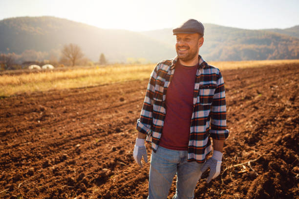 istock Farmer standing in the field 1343851012