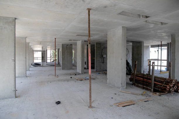 istock Interior construction of housing project with drywall installed and patched without painting applied 1343851394