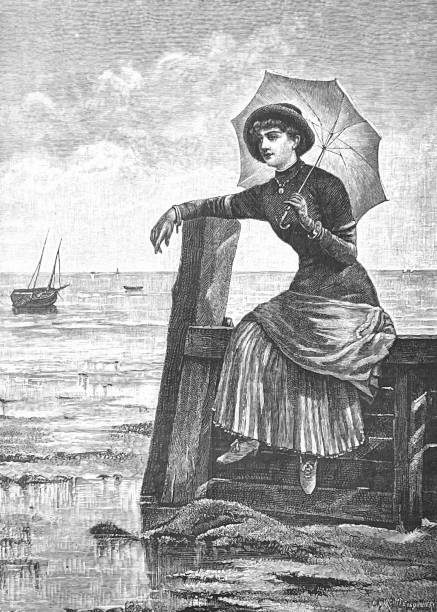 istock Young beauty holding an umbrella above her, sitting on a jetty in the harbor 1343852553