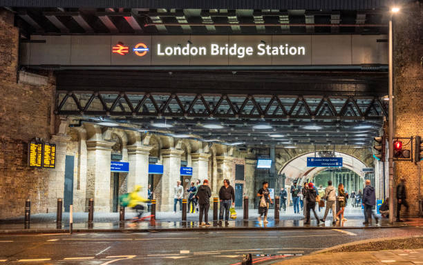 London, UK - People at the entrance of London Bridge rail and underground station, located south of the Thames in central London.