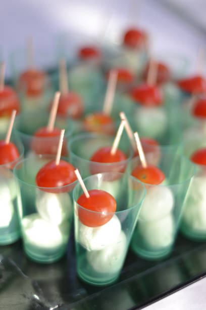 istock Small glasses with mozzarella and tomatoes as an appetizer. Finger food 1343859198