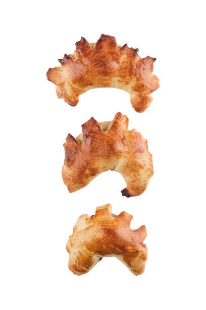 istock Isolate of fresh pastries - three bagels with cherry filling on a white background. 1343862557