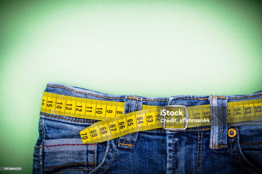 Jeans Jeans and measuring subject for weight loss Obesity Stock Photo