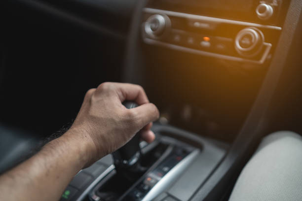 istock close up of hand's driver control car gear 1343865849