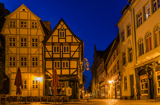 Evening atmosphere in the historic old town of Quedlinburg with half-timbered houses and cobblestones