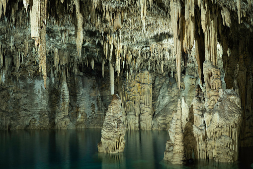 Stalagmites and stalactites in the beautiful closed cavernous cenote, Choj Ha, Chemax, Yucatan, Mexico