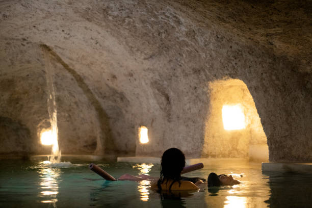 istock Floating massage in a salt cave cenote pool, Mexico 1343866464