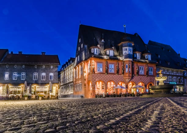 Blue hour on the historic market square with Kaiserworth and market fountain in Goslar