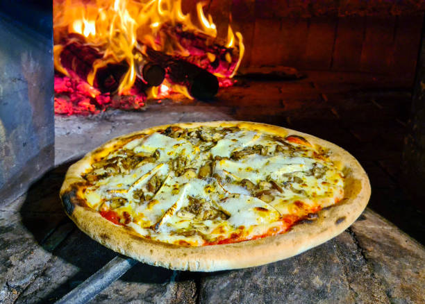 istock Baked pizza in the wood oven 1343867536