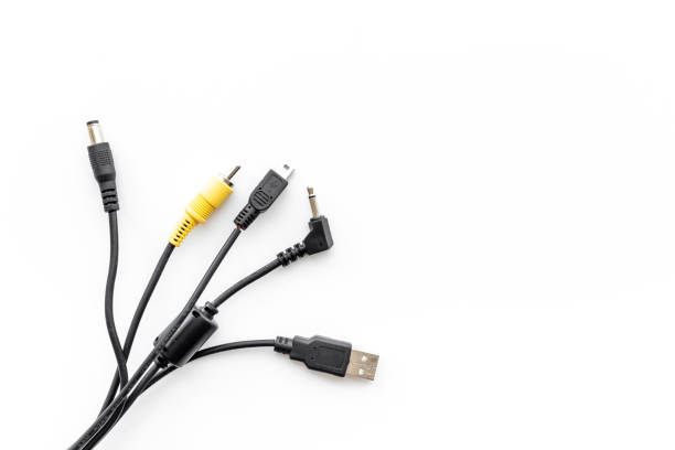 istock Cables for charging smartphone or laptop, top view 1343871016