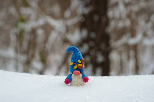 istock Figure of a dwarf in a snowy forest. 1343877294
