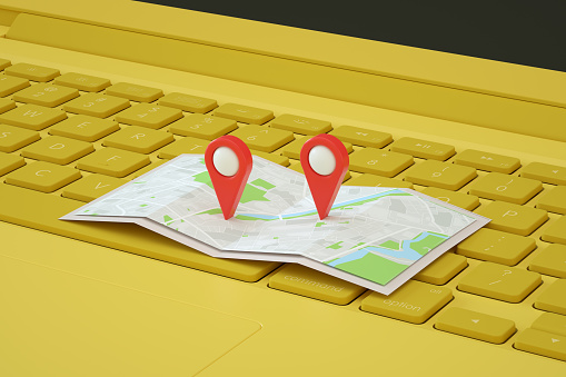 3D rendering of navigation map pointer, geo marker pin on laptop, travel destinations concept.