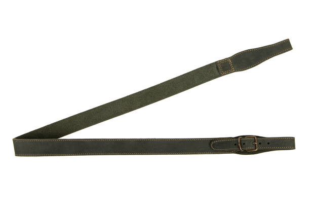 istock Green leather shoulder strap for a gun isolated on white background 1343880392