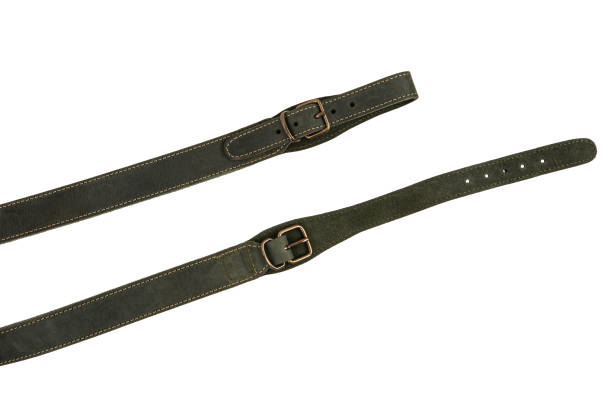 istock Green leather shoulder strap for a gun isolated on white background 1343880393
