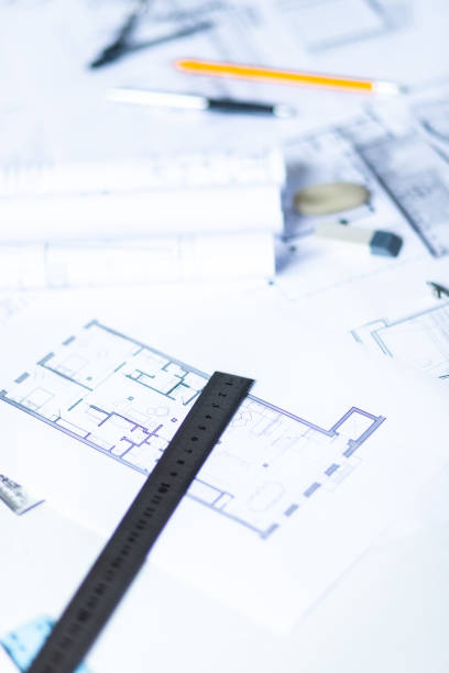 istock Photo of architectural project, blueprints and engineering tools. 1343882628