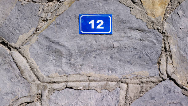 istock Door number on stone wall 1343884530