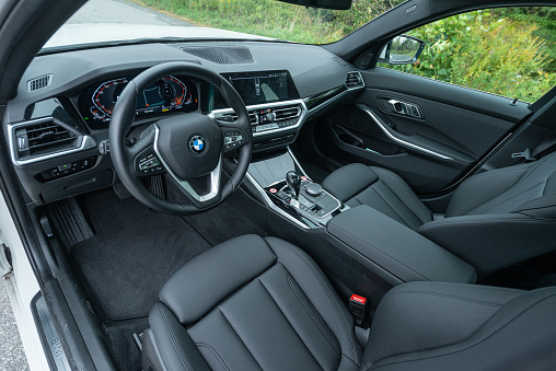 September 29, 2021 - Halifax, Canada - Driver's seat of a 2021 BMW 330i xDrive all wheel drive sedan featuring an intercooled turbocharged 2.0L engine.