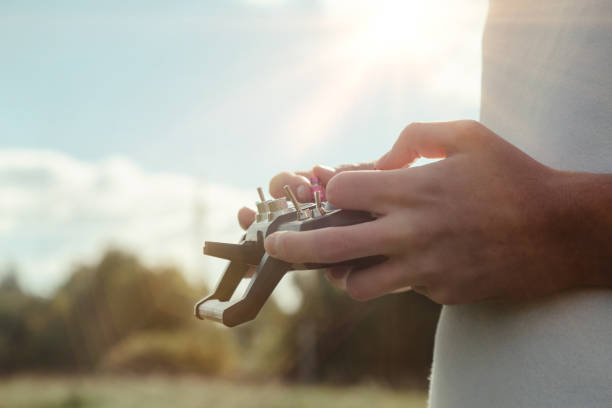 istock Drone quadrocopter controls off from man hands outdoors 1343887415