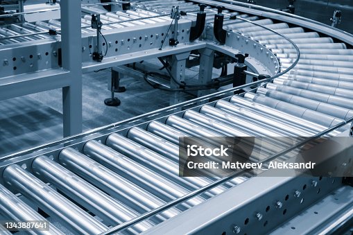 istock Crossing of the roller conveyor, Production line conveyor roller transportation objects 1343887641