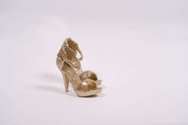 istock Small golden high heel ornament 1343887688
