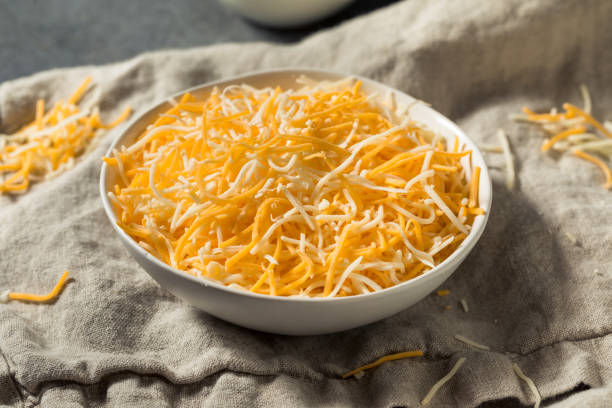 Organic Shredded Mexican Cheese Mix Organic Shredded Mexican Cheese Mix in a Bowl colby cheddar stock pictures, royalty-free photos & images