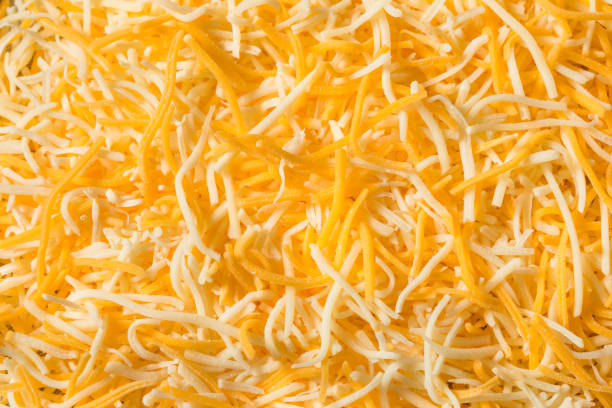 Organic Shredded Mexican Cheese Mix Organic Shredded Mexican Cheese Mix in a Bowl colby cheddar stock pictures, royalty-free photos & images