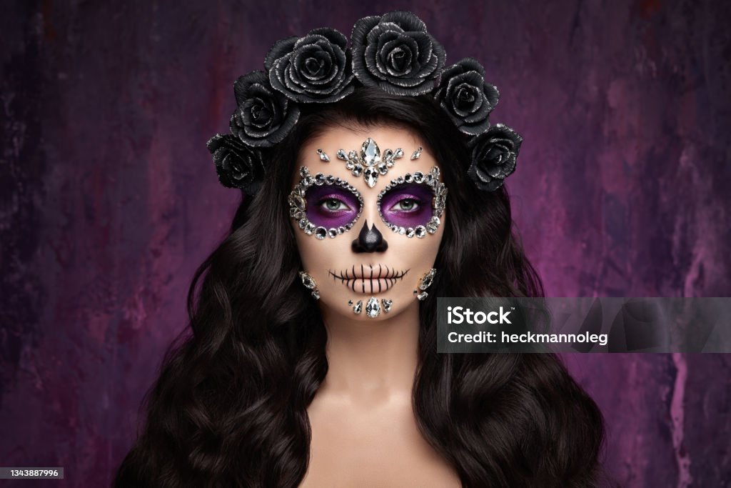 Portrait of a woman with makeup sugar skull Portrait of a woman with sugar skull makeup over red background. Halloween costume and make-up. Portrait of Calavera Catrina Halloween Stock Photo