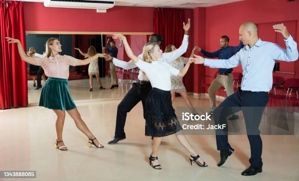 Couples Enjoying Boogiewoogie Stock Photo - Download Image Now - Swing Dancing, Ballroom, Dancing