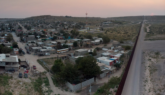 Moving Closeup International Border Wall from Sunland Park New Mexico Looking in to Puerto Anapra Chihuahua