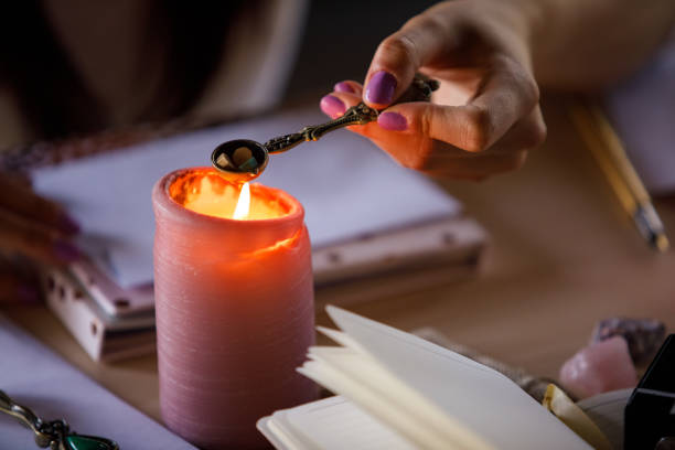istock Woman melting sealing wax over a candle 1343891002