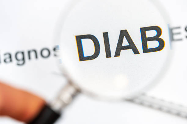 istock Words diabetes diagnosis with syringe through magnifying glass. 1343891088