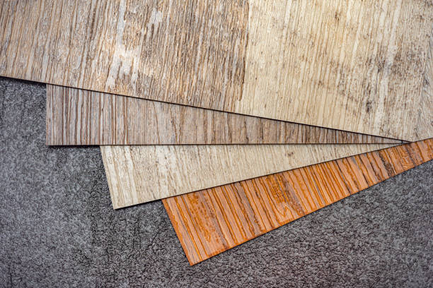 istock Vinyl floor, wood samples. Small colored boards. Image for design with copy space on black vinyl floor background 1343893246