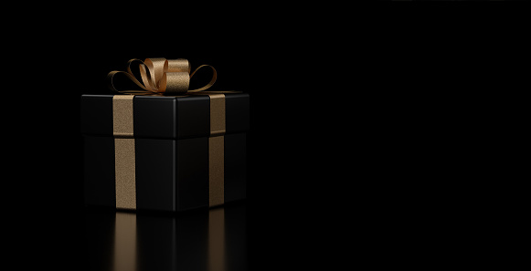 Modern Black And Golden Present / Gift Box Isolated On The Black Background. Christmas / New Year / Birthday Concept. Empty Space.