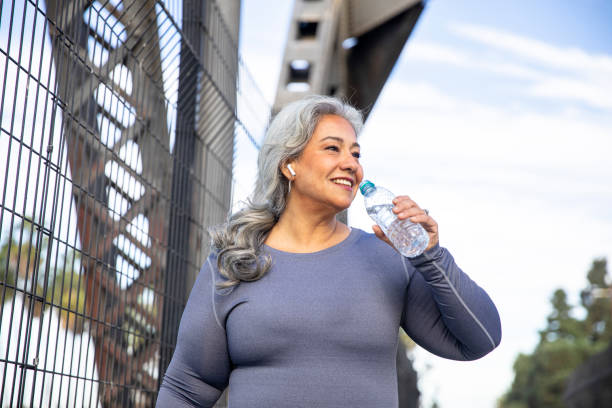 istock Senior Mexican Woman Drinking Water 1343896730