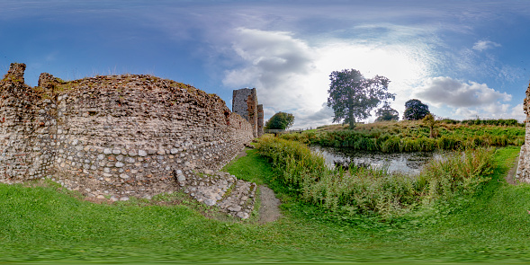 Baconsthorpe, Norfolk, UK – September 20 2021. 360 spherical panorama captured at Baconsthorpe castle in the county of Norfolk, UK. This castle is a 15th century moated and fortified manor house that was habited until the 1920s. The property was vacated when one of the turrets collapsed and has been left as ruins ever since
