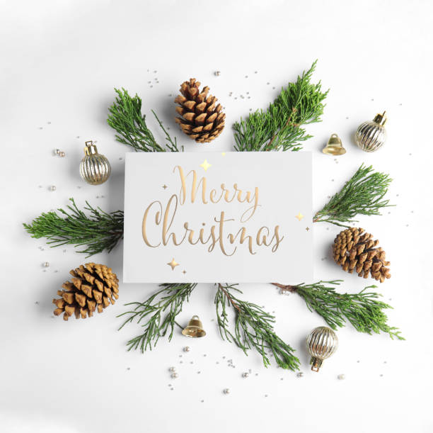 istock Flat lay composition with text MERRY CHRISTMAS and festive decor on white background 1343896847
