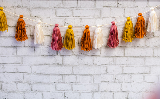 Pretty, colored, tassels hanging on a string - used for decor.