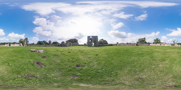 Baconsthorpe, Norfolk, UK – September 20 2021. 360 spherical panorama captured at Baconsthorpe castle in the county of Norfolk, UK. This castle is a 15th century moated and fortified manor house that was habited until the 1920s. The property was vacated when one of the turrets collapsed and has been left as ruins ever since