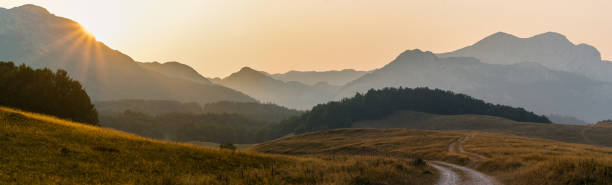 istock Hills and mountains illuminated by sunset light nature park 1343897952