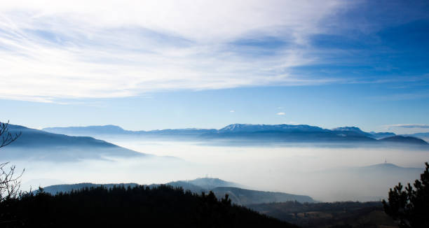 istock Fogy sea and mountain range in background 1343897980