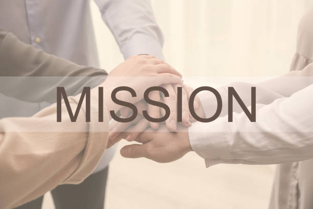 istock People holding hands together on light background, closeup. Mission concept 1343900375