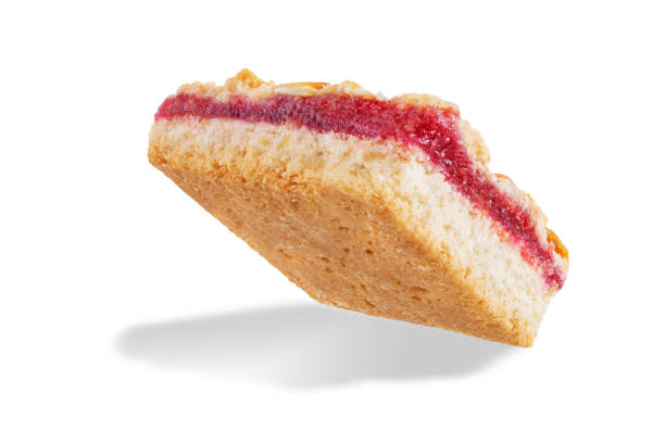 istock Sweet shortbread cookies with berry jam on a white isolated background 1343901160
